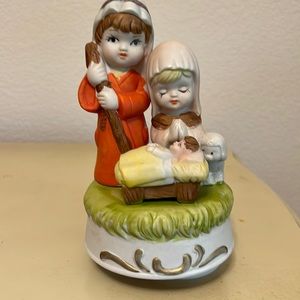 Manger scene Christmas ornament plays Silent Night
